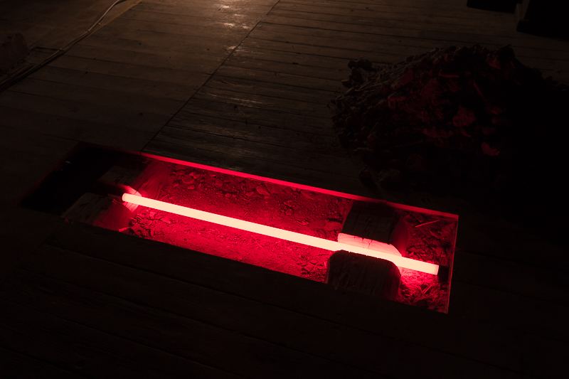 Archaeology — floor-level view of the lit trench