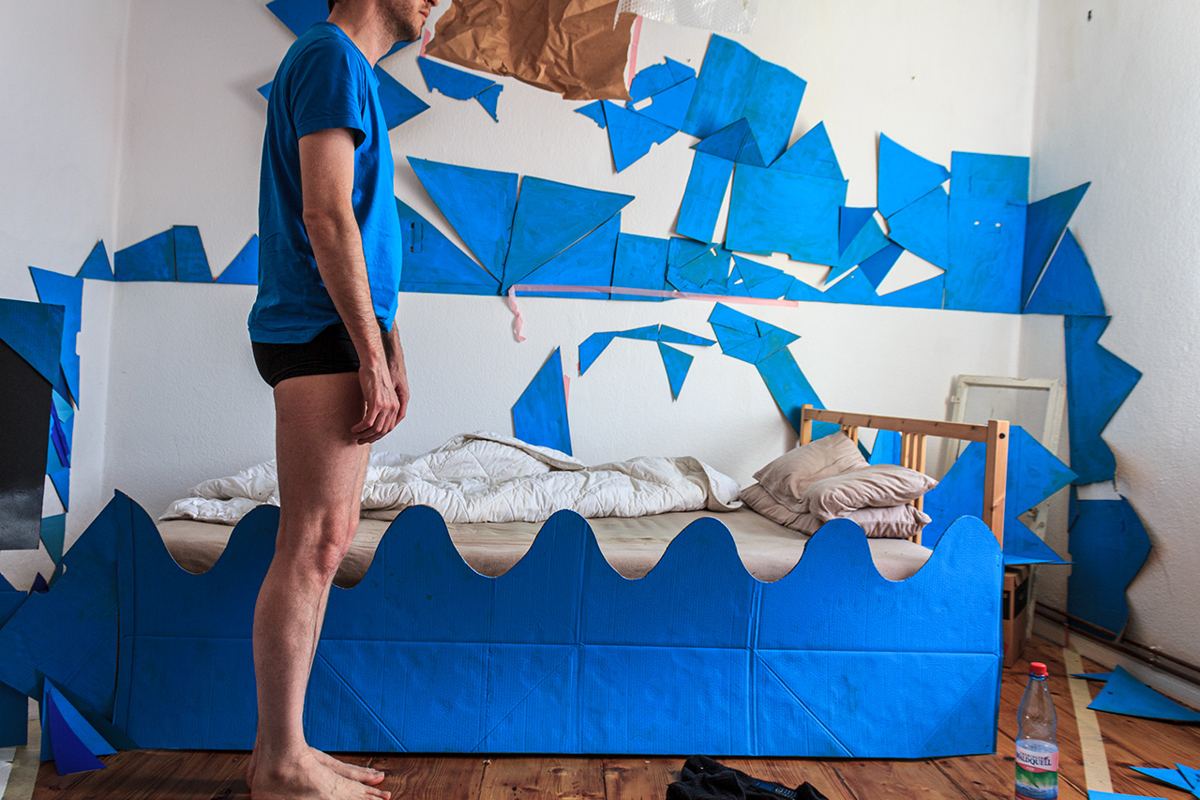 Dream Therapy — installation view, cardboard sculpture on bed