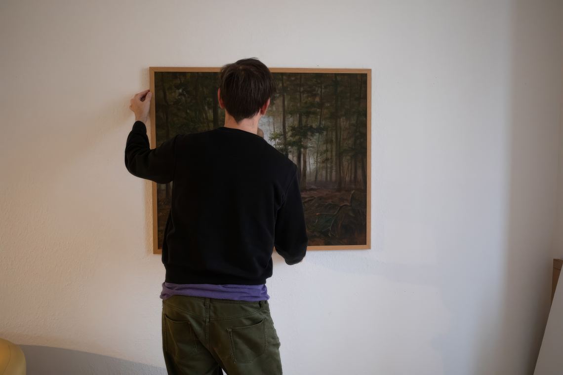 Brian Bixby installing Wolf Man In Forest in his studio, Germany